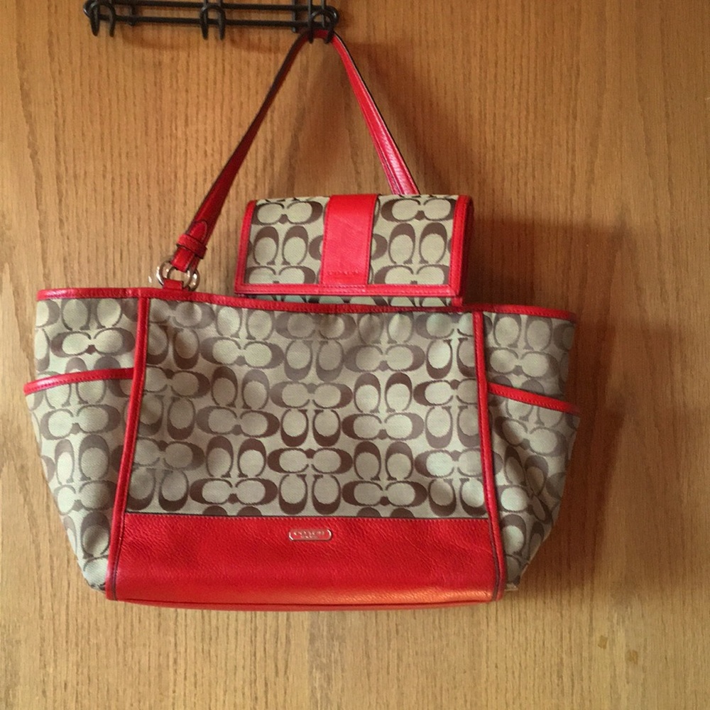 Signature Coach handbag and matching billfold.
